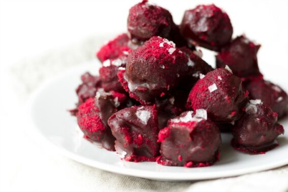 Sea salted chocolate raspberry caramels coated with flaked se salt and raspberry powder