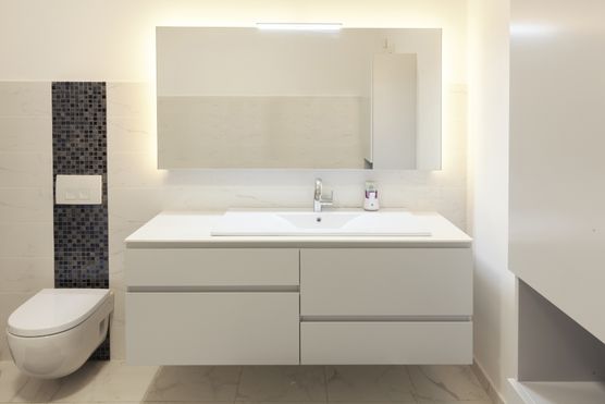 white colored hung bathroom vanity with modern decor