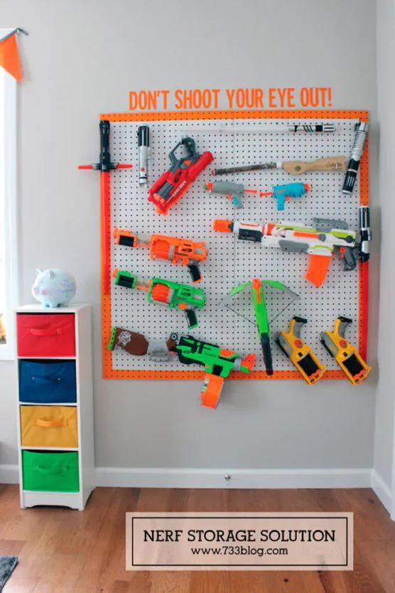 Peg board for storing nerf guns