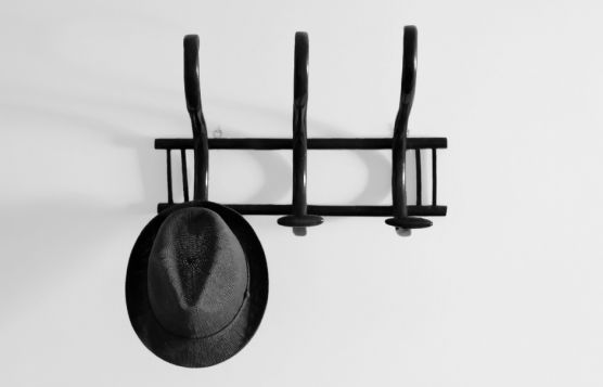 Hat hanged on an old coat hanger
