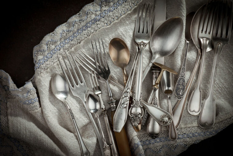 different silverwares on a cloth